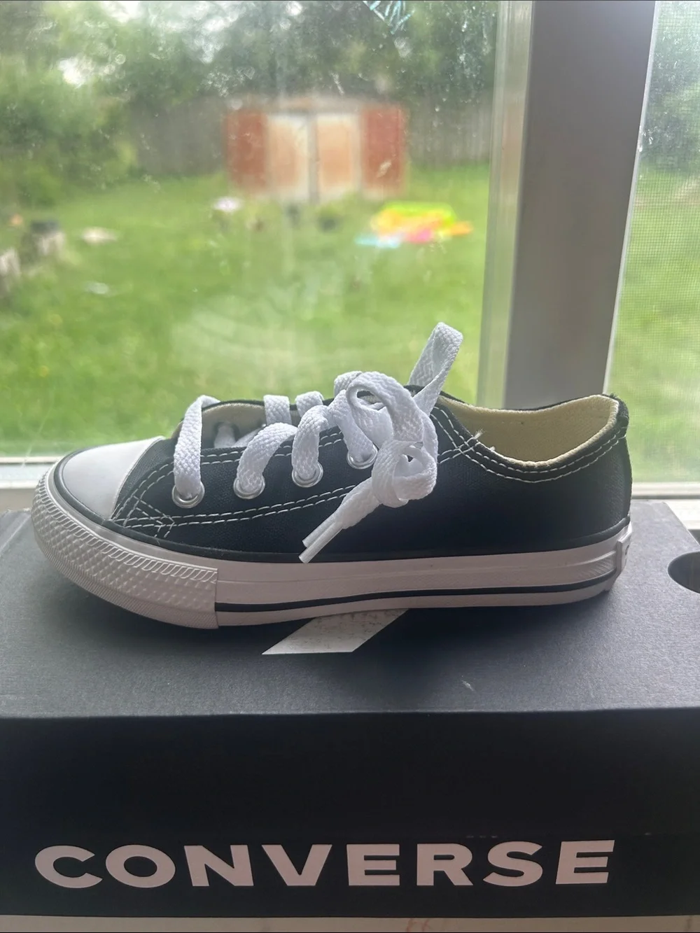 Converse Kids Low Top Sneaker in Black and White